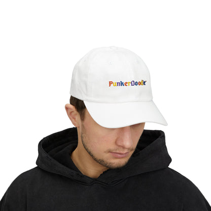 white cap with PunkerDoodle® logo on the front on top of persons head